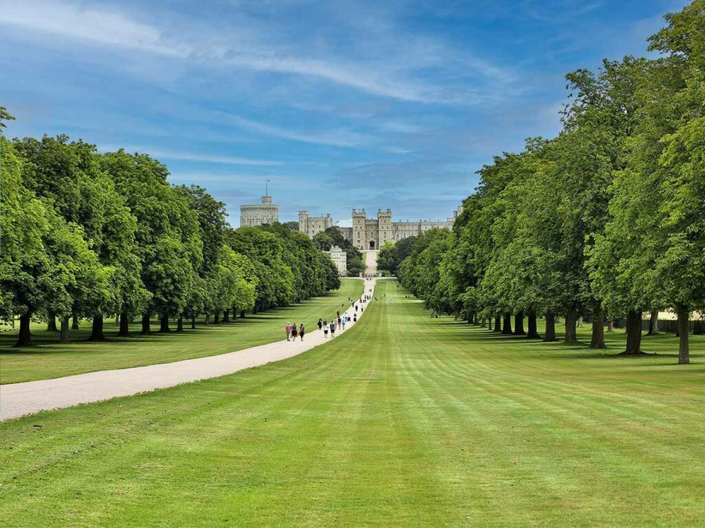 people walking up to the gates of windsor castle to start their tour.