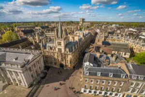 Aerial view of Cambridge, UK showcasing the historic architecture and bustling streets, ideal for tourists interested in English culture and history