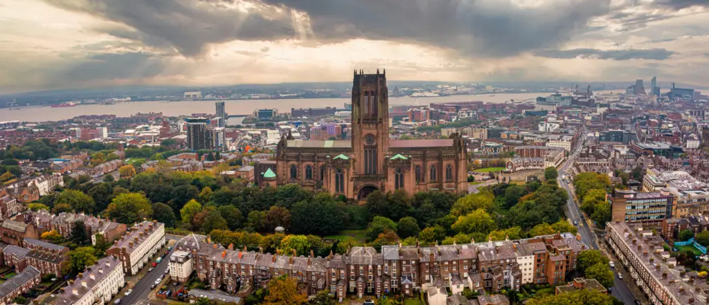 Aerial view of Liverpool Cathedral and surrounding cityscape in England, showcasing the iconic Gothic architecture and urban environment.