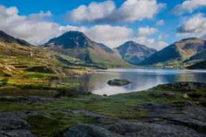 Scenic view of Wastwater Lake with surrounding mountains in the Lake District, Cumbria, England, showcasing breathtaking natural beauty ideal for tourism.